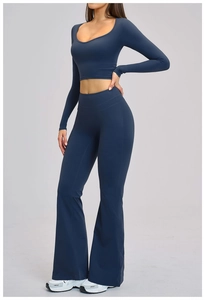 Women's dark blue yoga set with long sleeve crop top and high waist flared leggings