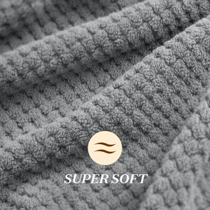 Macro detail of gray waffle texture microfiber hair towel with Super Soft label
