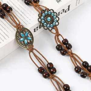 Bohemian hand-woven brown rope waist chain with bronze butterfly flower and blue beads