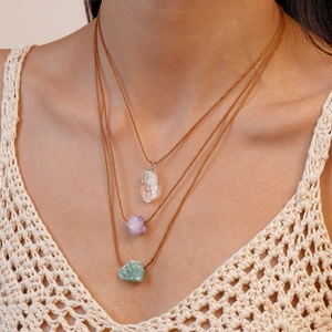 Three-layer bohemian necklace featuring natural irregular crystals on brown cord