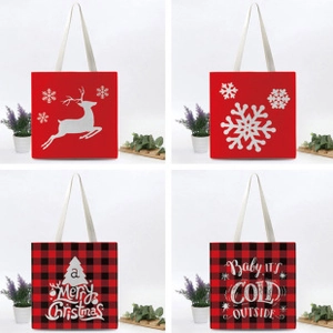 Detail showing four Christmas tote bags in red and plaid canvas with festive holiday patterns