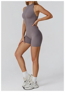 Full view of a taupe high-stretch athletic romper with a zipper mock neck and slim fit