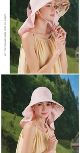 Pink sun hat with large brim and neck flap featuring tropical leaf print lining