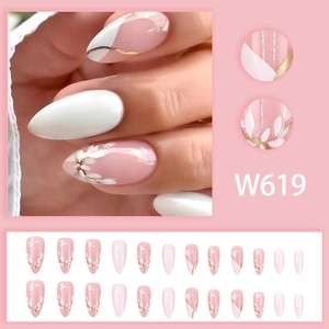 Pink almond press-on nails with white flower motifs and gold trim accents, 24 piece set