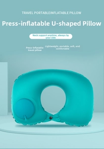 Close-up of integrated press pump on turquoise inflatable U-shaped travel neck pillow