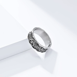 Macro shot of silver Eye of Horus stainless steel ring with vintage geometric engraving