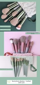 Detail of 13-piece makeup brush set with matte handles and velvet drawstring pouch