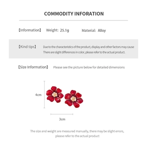 Detailed view of red flower drop earrings with size measurements 4cm by 3cm and alloy texture