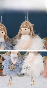 Close-up of plush Christmas angel hanging ornaments with glitter wings and stars