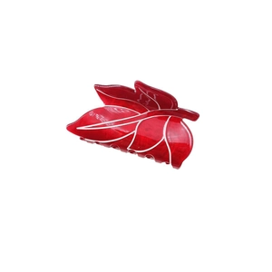 Leaf shaped red acetate hair claw clip with white marble texture and glossy finish