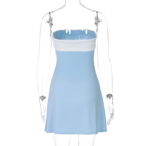 Detail of light blue bodycon mini dress featuring a white contrast patchwork bust design