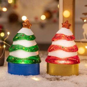Luminous Christmas tree tabletop decorations with LED lights and warm bokeh background