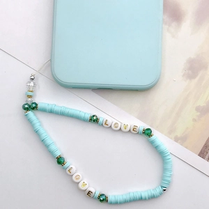 Handmade light blue polymer clay phone strap with LOVE beads and green glass accents