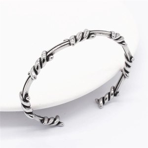 Vintage silver twisted cable bangle for men with a minimalist industrial open design