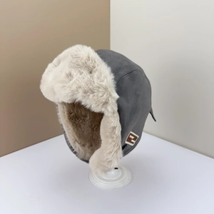 Deep grey winter trapper hat with warm faux fur lining and ear flaps for cold weather