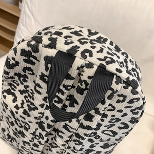 Leopard print corduroy backpack for women showing top handle and back strap details