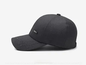 Detail view of dark grey baseball cap featuring fashion tag and mountain 318 embroidery