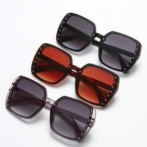 Fashionable oversized square sunglasses with gold rivet accents in three stylish colors
