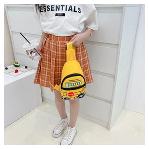 Close-up of yellow school bus shaped kids chest bag with adjustable strap and stop sign