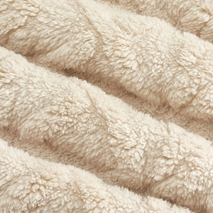 Detailed macro view of soft cream Sherpa fleece fabric showing warm fuzzy texture