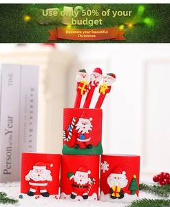 Detailed view of Christmas themed stationery set with Santa holders and decorative pens