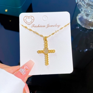 Luxurious gold titanium necklace with a zircon-encrusted cross and palm pendant