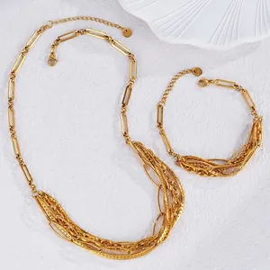 Gold plated stainless steel jewelry set with layered oval links and paperclip chains