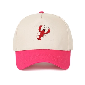 Detail of red lobster embroidery on two-tone cotton baseball cap with premium stitching