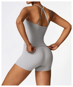 Rear view of grey seamless brushed yoga tank top and matching high-waisted gym shorts