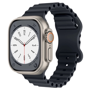Detailed close-up of a black wavy silicone ocean strap on a metallic sports smartwatch