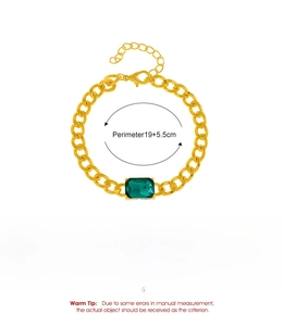 Detail view of gold cuban chain bracelet featuring a green square zircon and sizing specifications