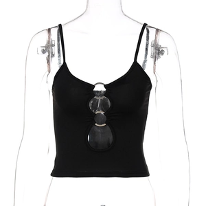 Detail of black cropped camisole featuring hollow-out front and metallic ring accent