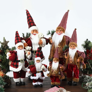 Standing Santa Claus figurines in red plaid and gold vintage outfits for holiday decor