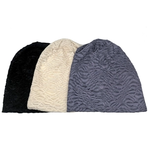 Three-piece set of solid color slouchy beanies in black, beige, and grey with wave texture