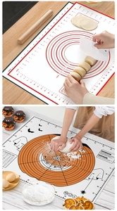 Close-up of thick silicone baking mats with measurements and Halloween patterns