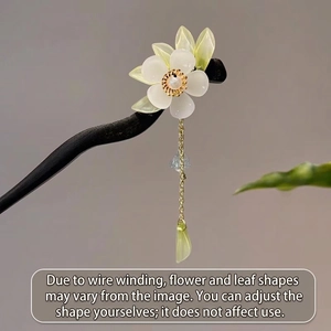 Vintage wooden hair pin with white magnolia flower and dangling green leaf tassels