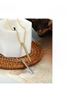 Bamboo style necklaces in gold and silver finish displayed on aesthetic background