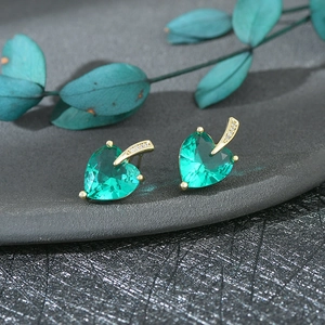 Elegant gold heart earrings with green gemstones and sparkling small diamonds for women