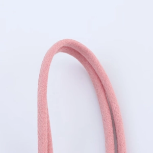 Detailed close-up of pink knit midi dress shoulder strap showing fine fabric texture