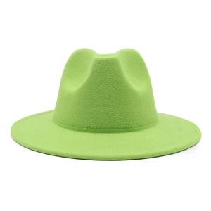 Detail of wide brim felt fedora hat in vibrant lime green with a classic silhouette