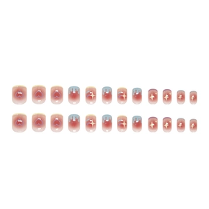 Pink gradient press-on nails with blue drip tips and heart star doodle patterns