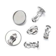 Close-up of silver stainless steel earring clips with round flat base for DIY jewelry