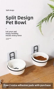 Detail of wall-mounted double pet bowls with white ceramic bowls and black metal bracket