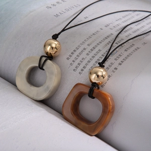 Zen style irregular square resin pendant necklaces in cream and brown with black cords