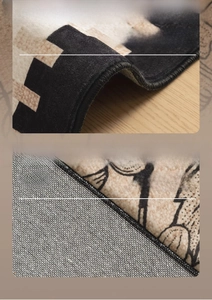 Detail of premium overlock stitching and breathable cotton backing on French vintage rug