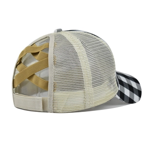 Detail of mesh baseball cap featuring a ponytail hole and beige criss-cross elastic bands