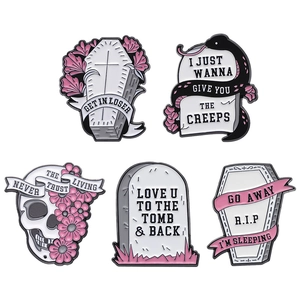 Gothic Halloween enamel pin set with pink flowers, skulls, and spooky gravestones
