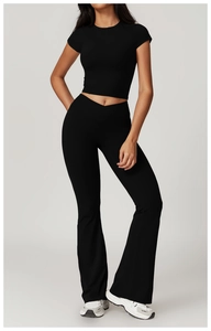 Detail of eco-friendly black yoga set with cropped top and V-waist flared pants