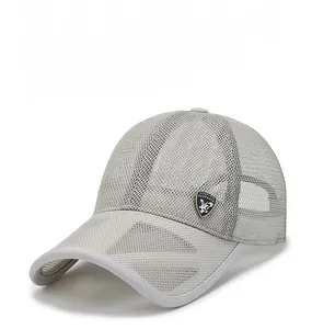 Detail of light gray mesh baseball cap showing breathable texture and silver shield logo