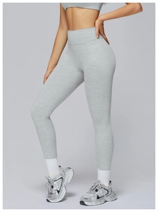 Detail showing high-waisted heather grey yoga leggings with premium brushed fabric texture
